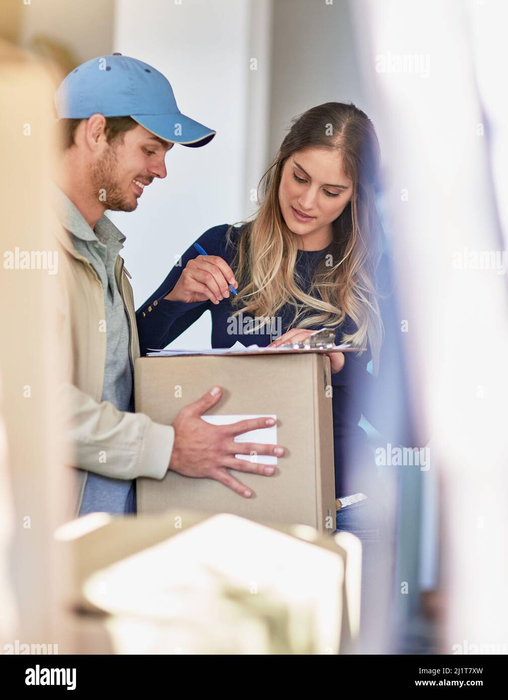 Making Delivery Delivery woman carrying package hi-res stock photography and images - Alamy