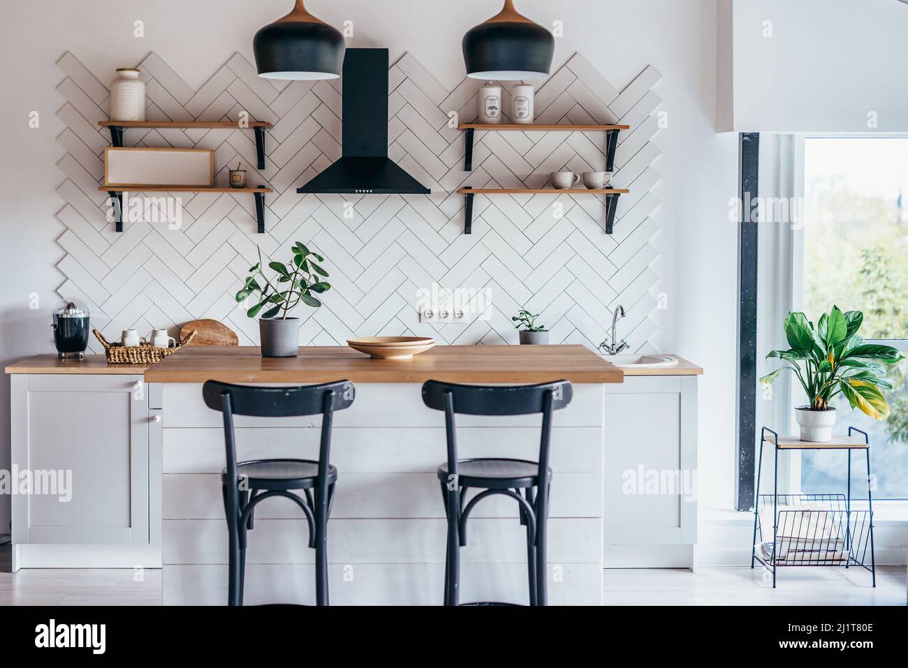 Modern new light interior of kitchen with white furniture and dining ...