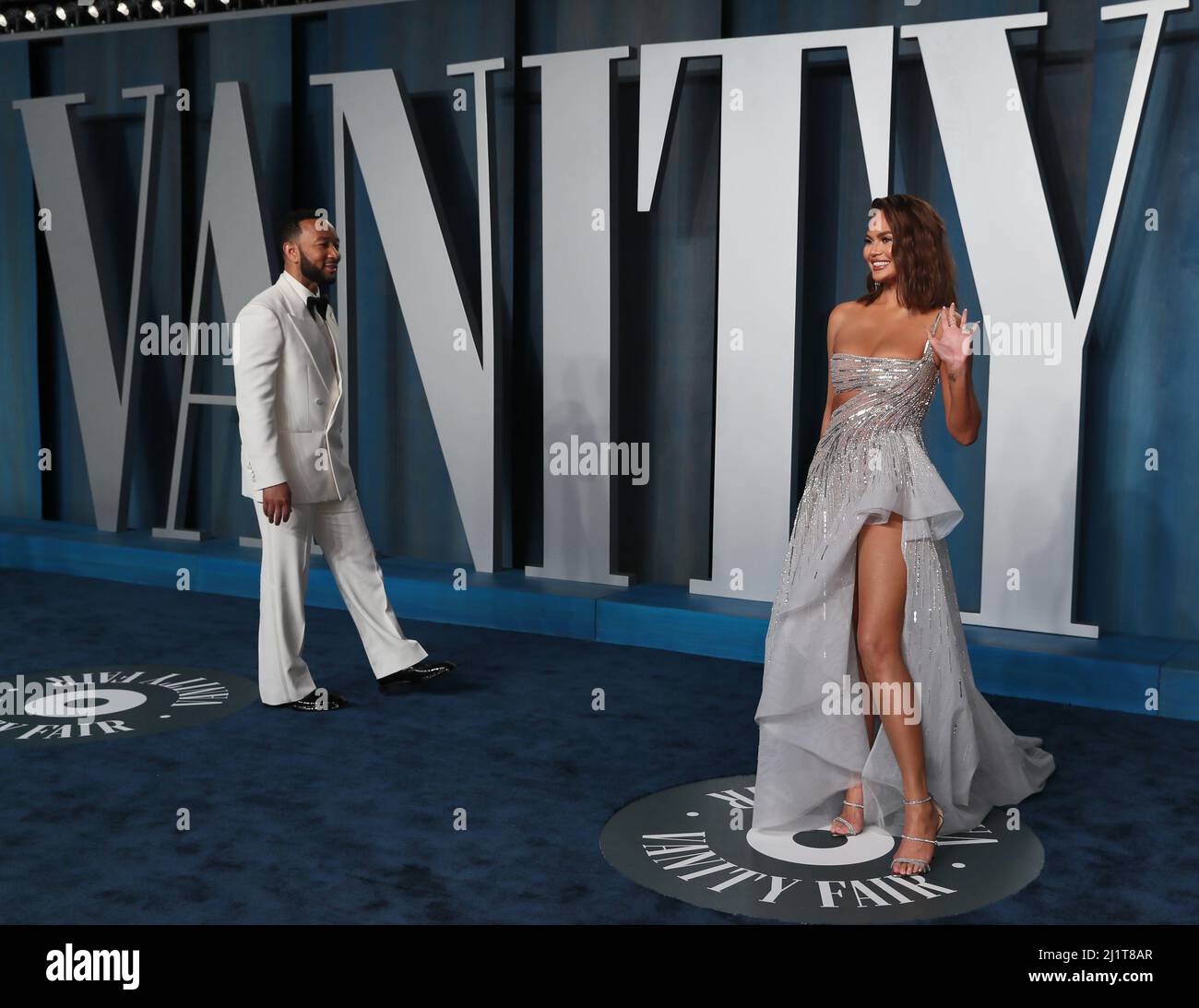 Chrissy Teigen and John Legend arrive at the Vanity Fair Oscar party during the 94th Academy Awards in Beverly Hills, California, U.S., March 27, 2022.     REUTERS/Danny Moloshok Stock Photo