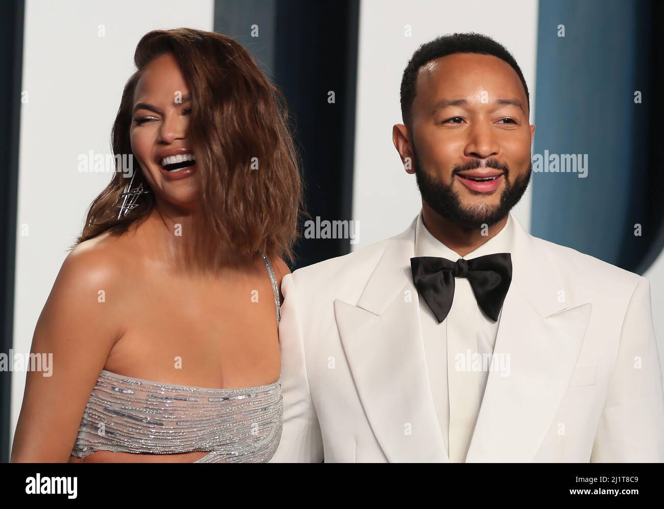 Chrissy Teigen and John Legend arrive at the Vanity Fair Oscar party during the 94th Academy Awards in Beverly Hills, California, U.S., March 27, 2022.    REUTERS/Danny Moloshok Stock Photo