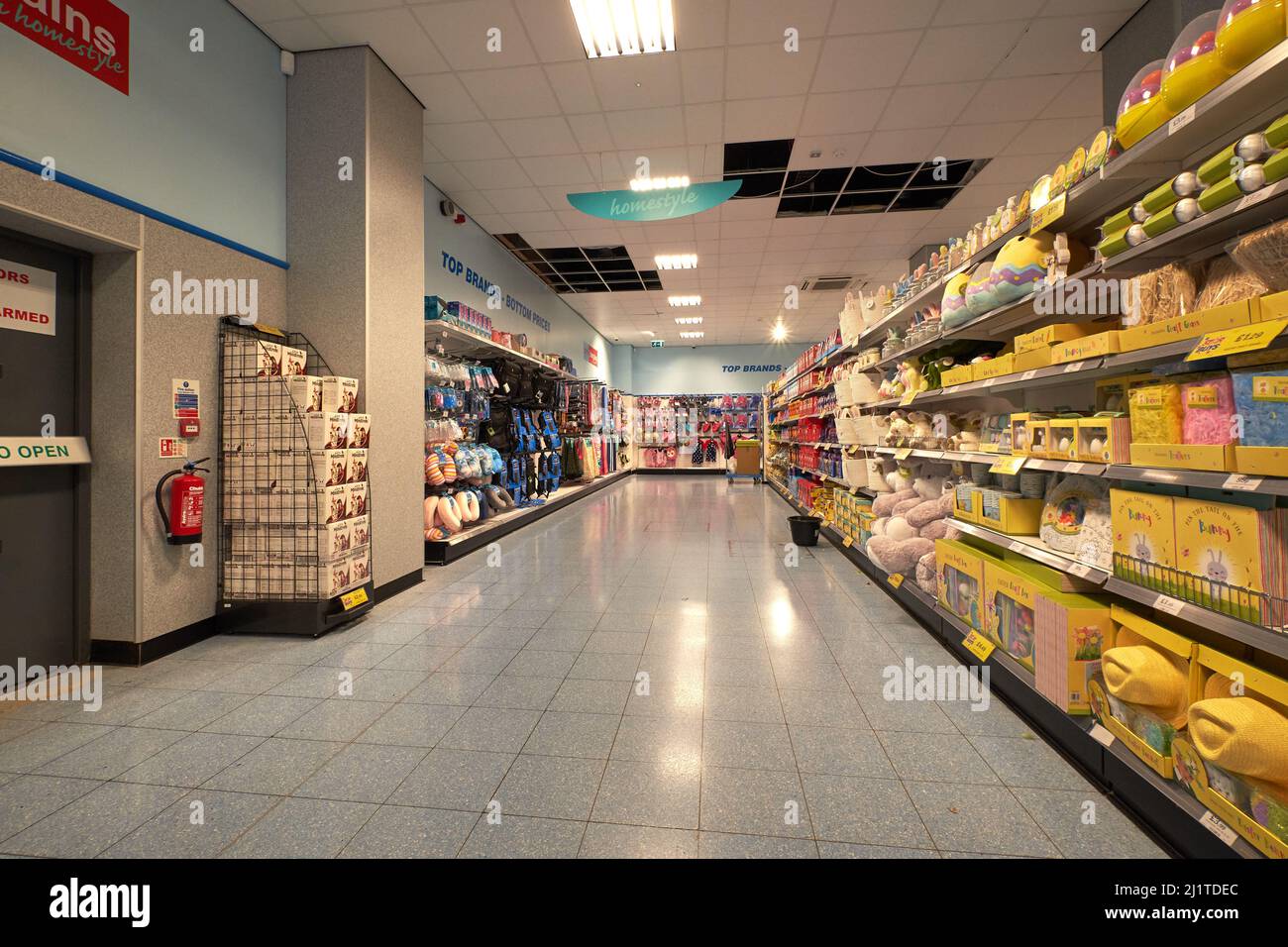 Deserted supermarket shelves and aisle Stock Photo Alamy