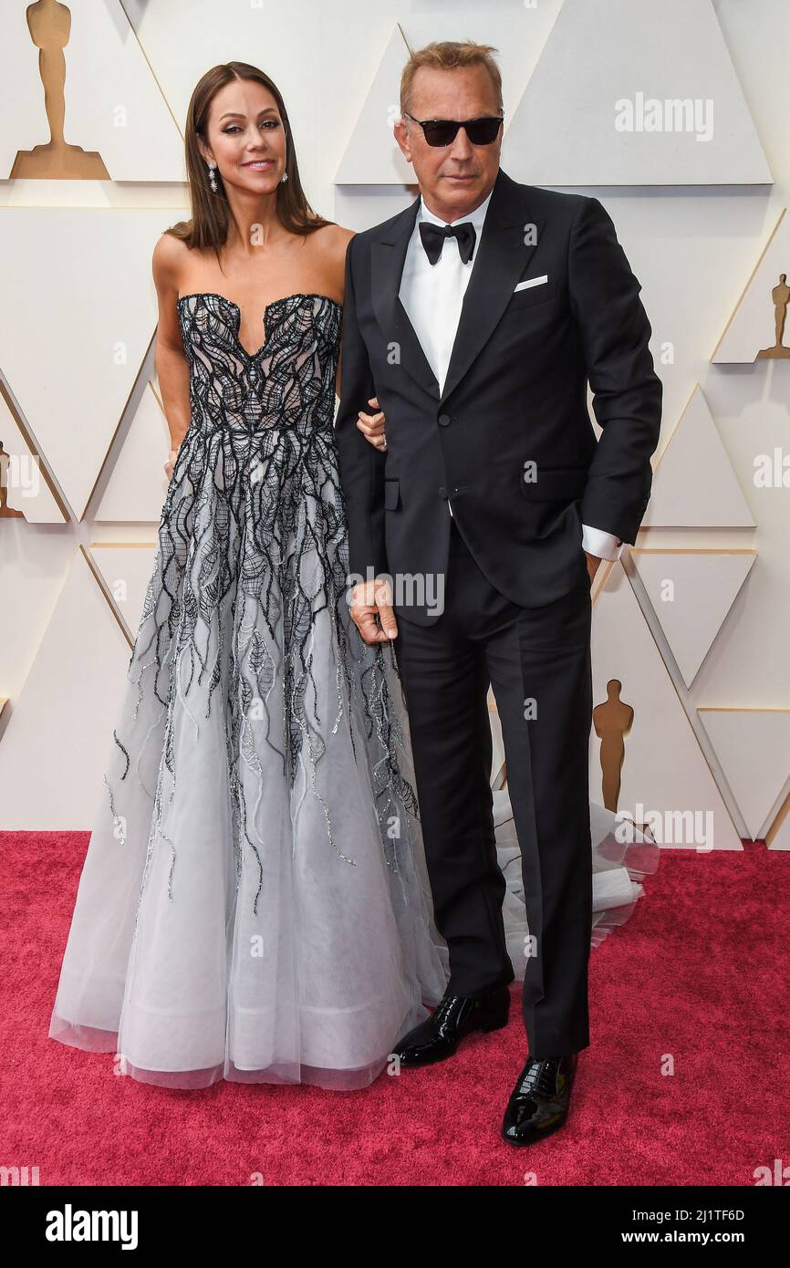 Los Angeles, USA. 27th Mar, 2022. Christine Baumgartner and Kevin Costner walking on the red carpet at the 94th Academy Awards held at the Dolby Theatre in Hollywood, CA on March 27,