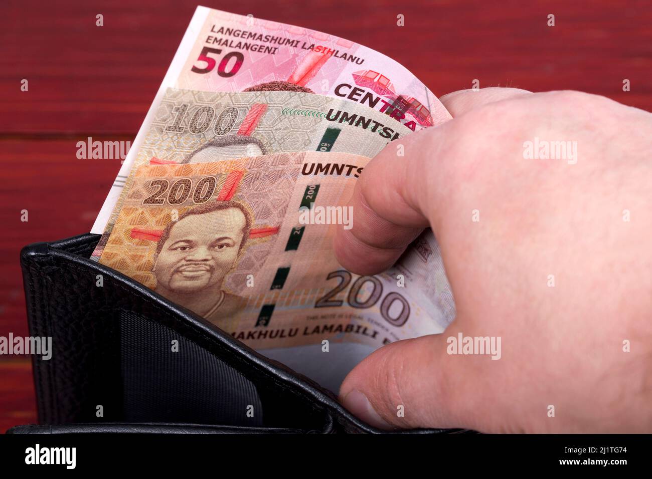 Swazi money - lilangeni in the black wallet Stock Photo