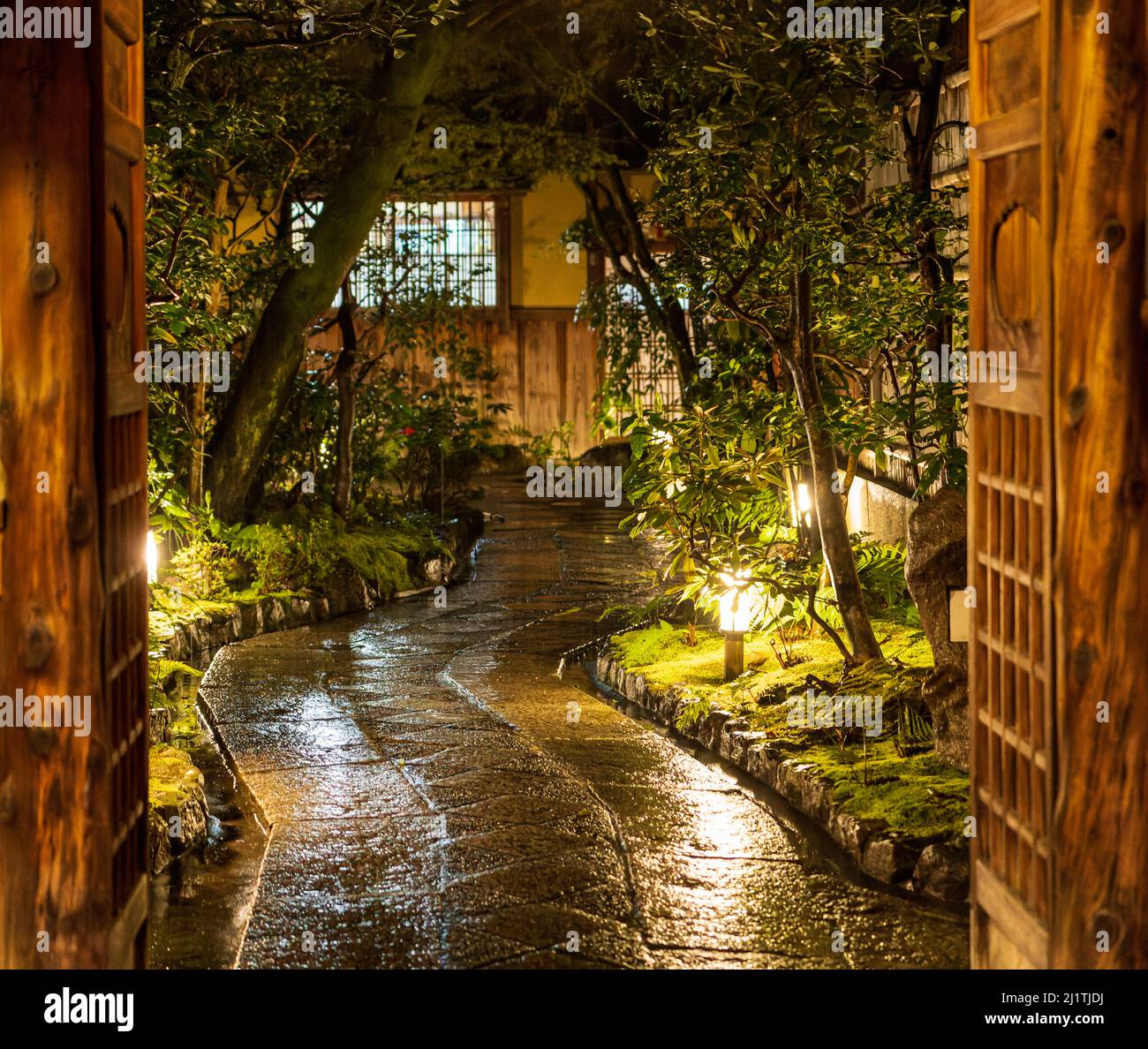 Wet stone path through Japanese garden at night Stock Photo Alamy