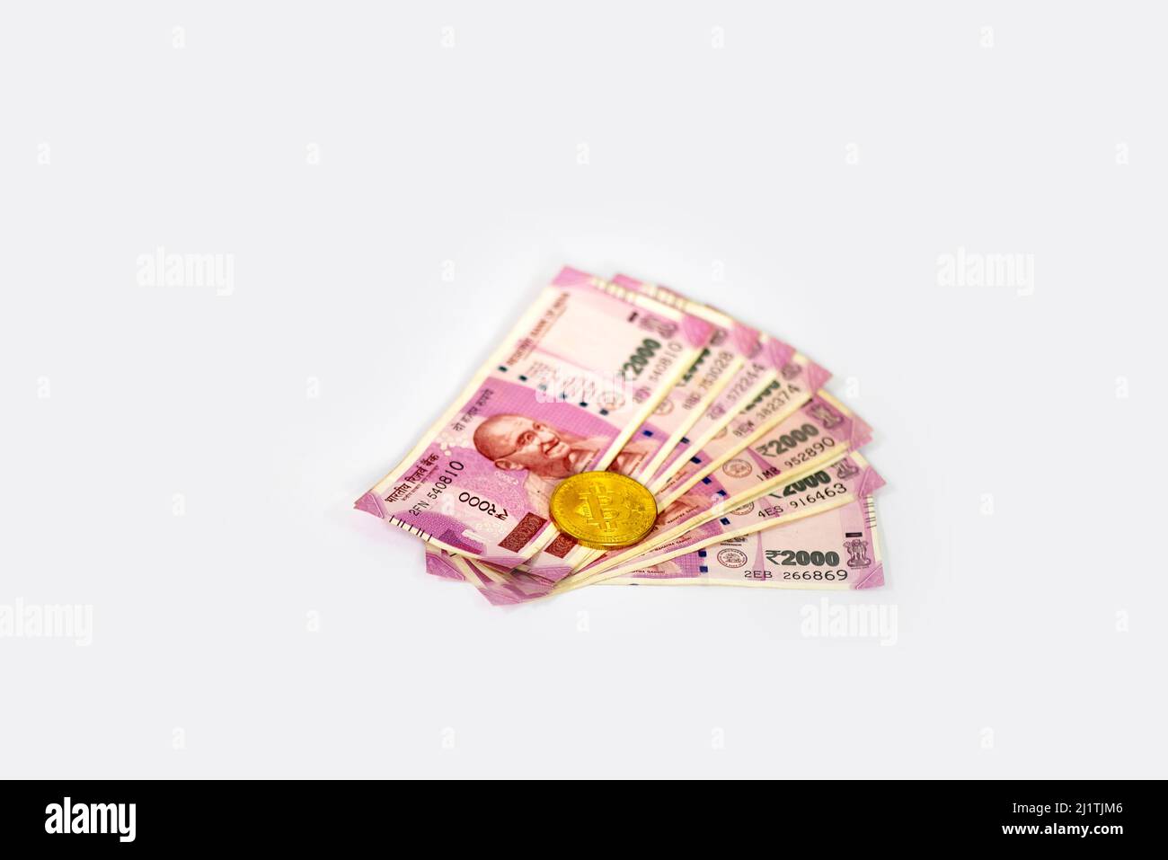 Indian rupees and bit coin isolated on white background Stock Photo