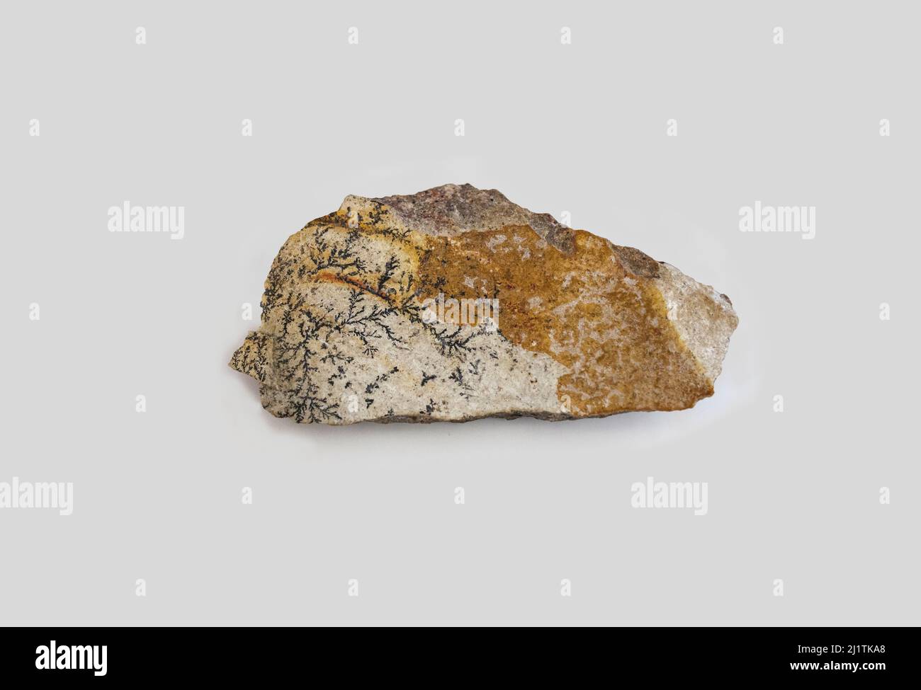 Pyrolusite amber fragment. Selective focus. Isolated over white background Stock Photo