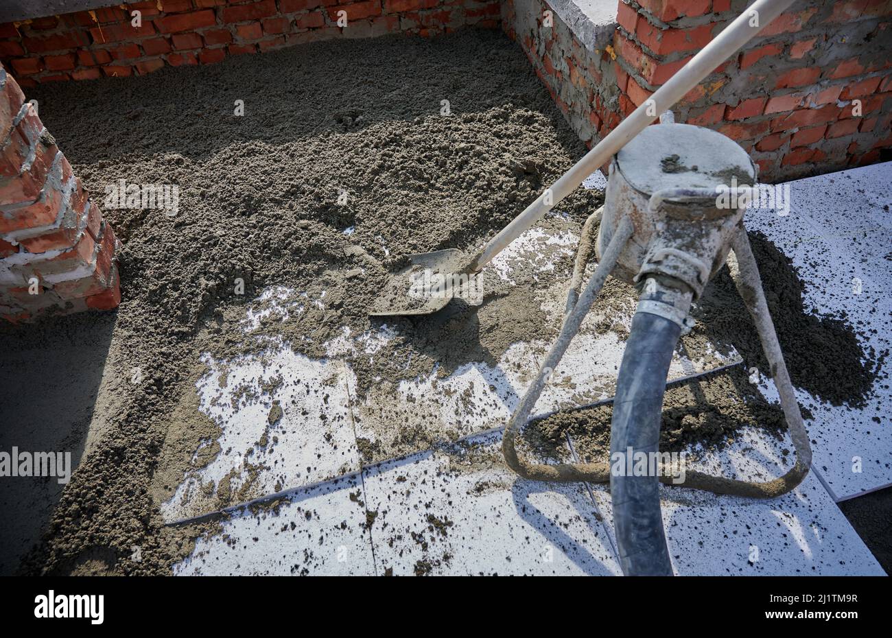 Close up of cement with shovel for construction of walls. Concept of process construction of house or shop with special materials and equipments. Stock Photo