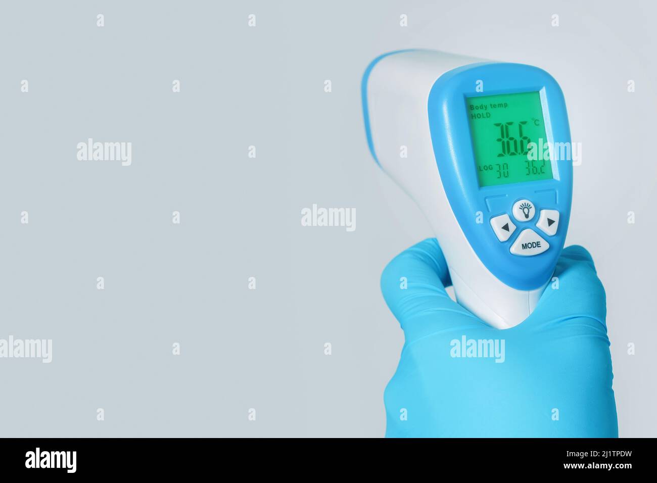 Thermometer showing a normal body temperature 36.6 celsium Stock Photo