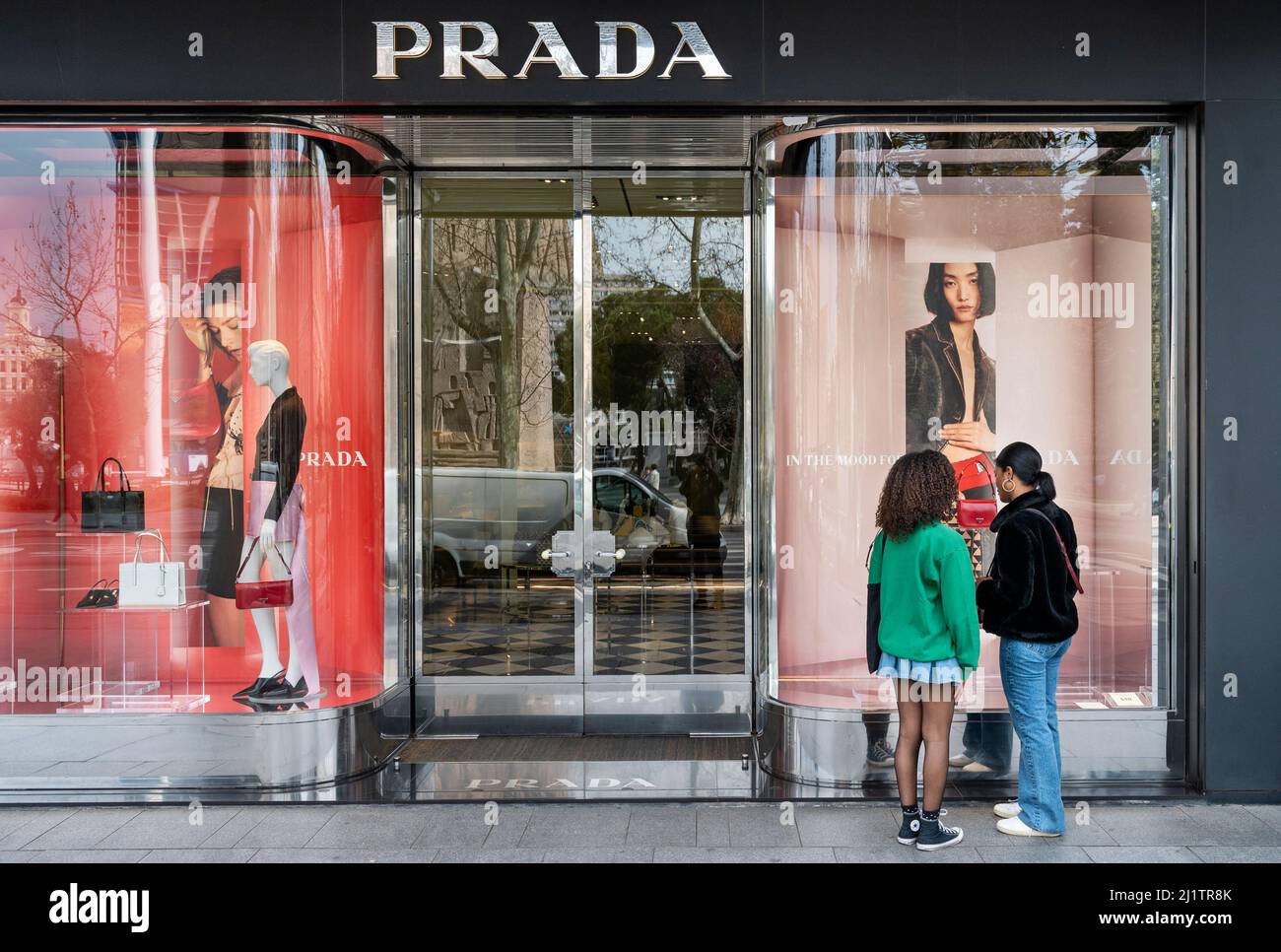 Shoppers window shopping at the Italian luxury fashion company Prada logo  and store seen in Spain. (Photo by Xavi Lopez / SOPA Images/Sipa USA Stock  Photo - Alamy