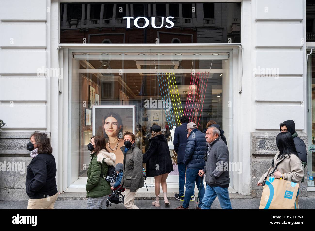 Madrid, Spain. 24th Mar, 2022. Pedestrians walk past the Spanish jewelry,  accessories, and fashion retailer Tous