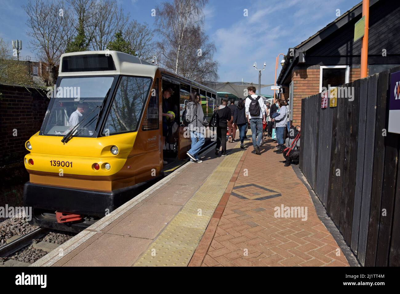 Passengers getting on and off the Class 139 Stourbridge Shuttle, the UK's smallest train in public servcie, at Stourbridge Town railway station 03/22 Stock Photo