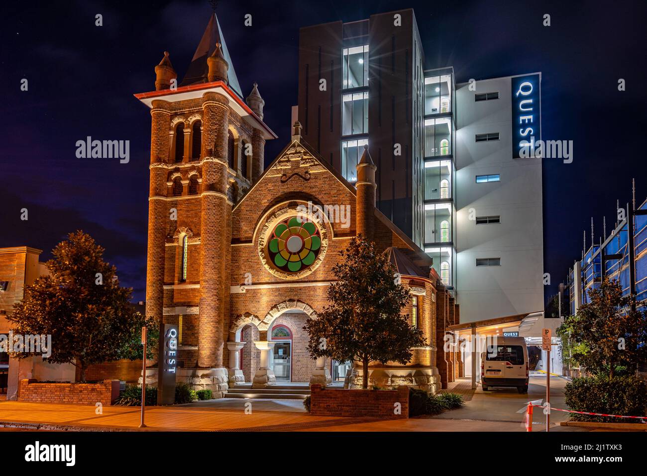 Toowoomba, Queensland, Australia - Quest hotel built above the converted church building at night Stock Photo
