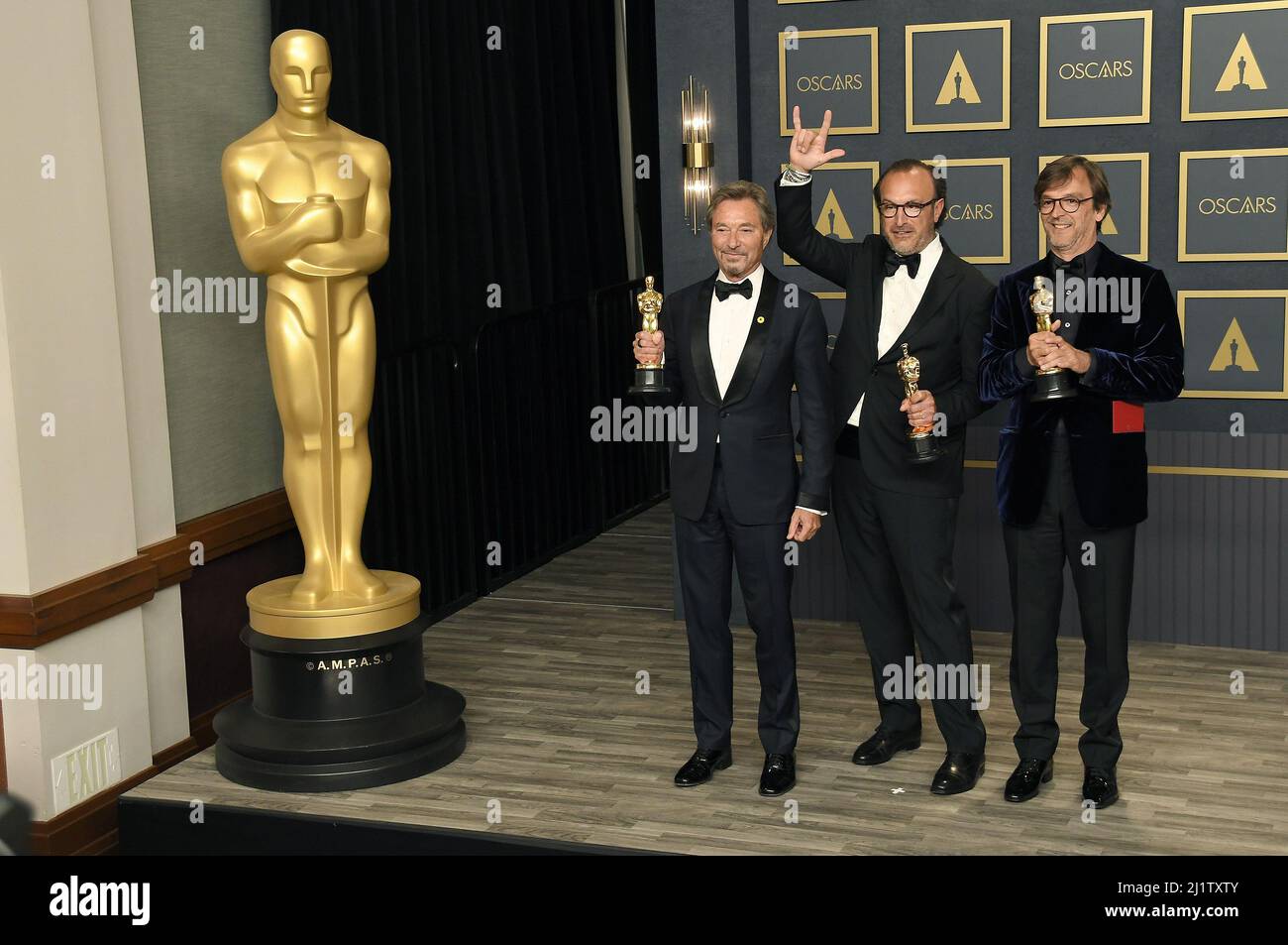 Los Angeles, USA. 27th Mar, 2022. (L-R) Patrick Wachsberger, Fabrice Gianfermi, and Philippe Rousselet, winners of the Best Picture award for ‘CODA, ' posing on stage in the press room at the 94th Academy Awards held at the Dolby Theatre in Hollywood, CA on Sundayday, ?March 27, 2022. (Photo By Sthanlee B. Mirador/Sipa USA) Credit: Sipa USA/Alamy Live News Stock Photo