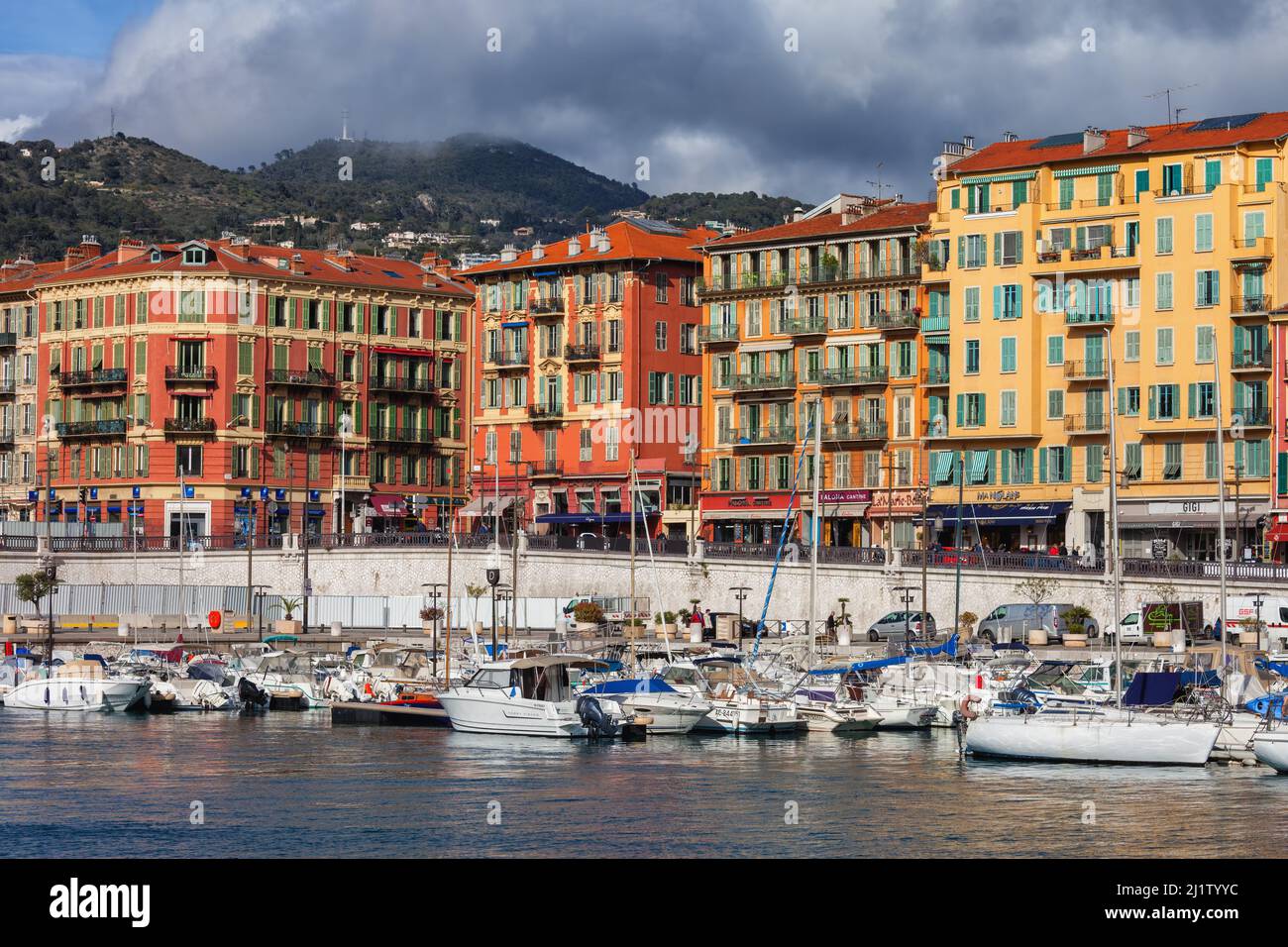 Nice, France - April 13, 2018: Buildings and boats in Port Lympia, Old Port of Nice on French Riviera. Stock Photo