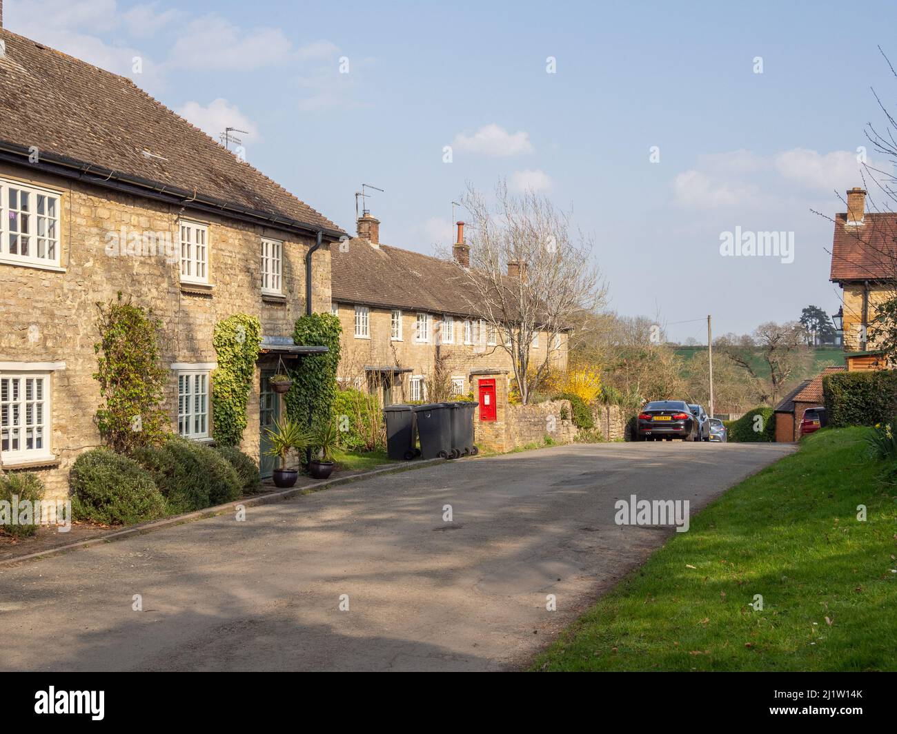 Street view in Spring in the attractive hamlet of Courteenhall, Northamptonshire, UK Stock Photo