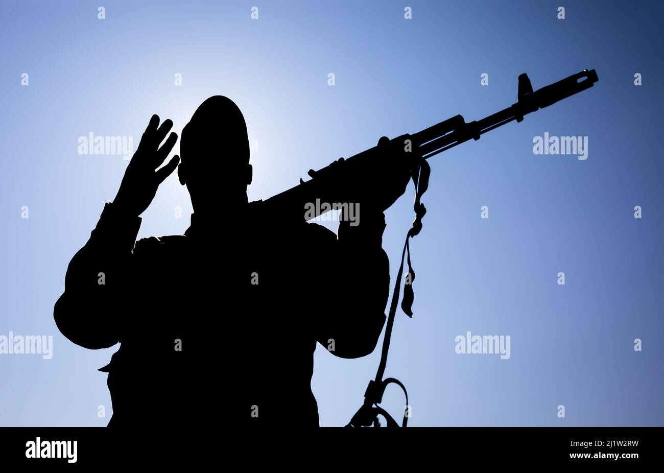 Silhouette of a Kyiv territorial defense member with a kalashnikov in his hands, Kyiv, Ukraine, March 25, 2022 Stock Photo