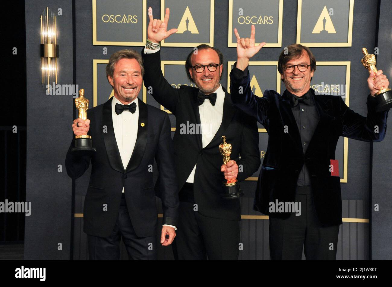 Los Angeles, CA. 27th Mar, 2022. Patrick Wachsberger, Philippe Rousselet, Fabrice Gianfermi in the press room for 94th Academy Awards - Press Room, Dolby Theatre, Los Angeles, CA March 27, 2022. Credit: Elizabeth Goodenough/Everett Collection/Alamy Live News Stock Photo