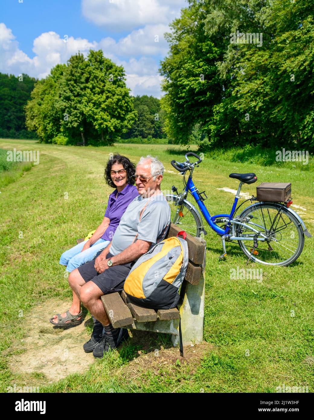 Senior couple enjoying beautiful nature during cycling tour Stock Photo ...