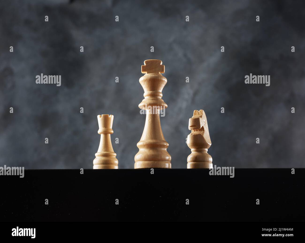 Majestic view of the king, knight and rook with smoke background ...