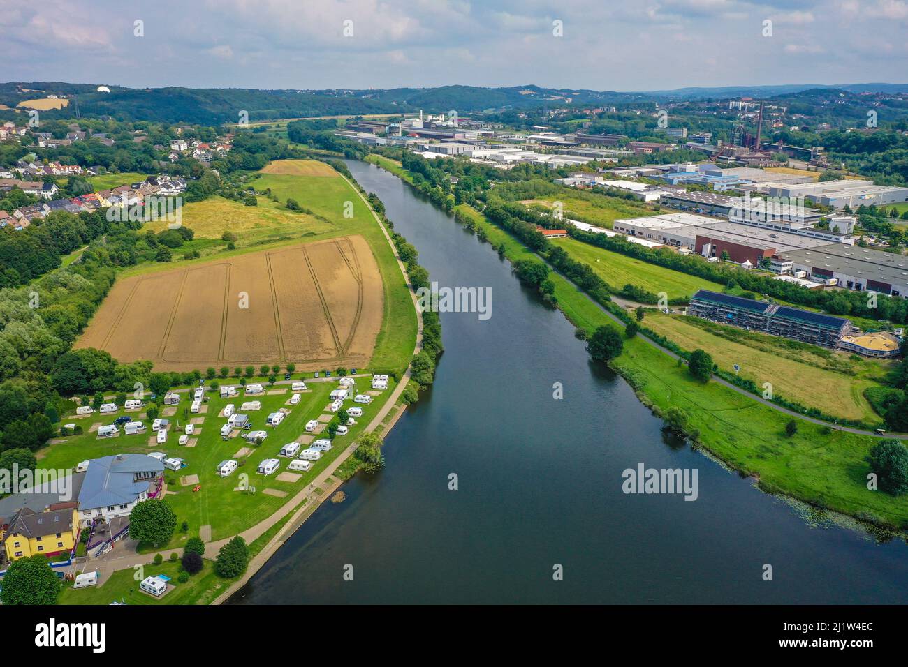 Hattingen, North Rhine-Westphalia, Germany - cityscape at the Ruhr, Ruhr promenade, in front a camping site, in the back the LWL Industrial Museum Hen Stock Photo