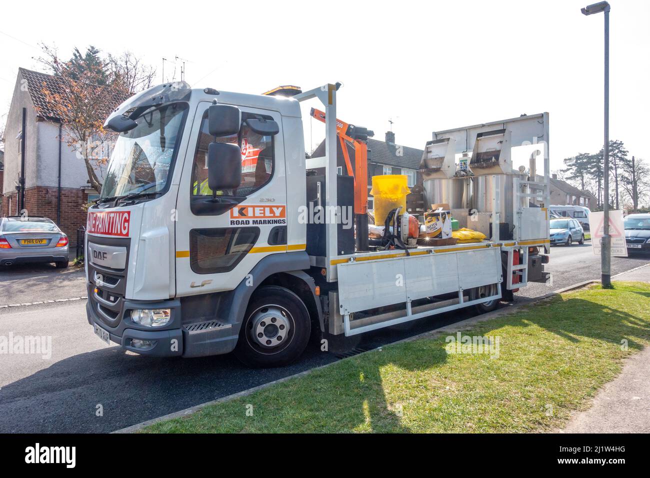 A line painting truck parked at the side of a road to repaint lines on a newly resurfaced road. Stock Photo