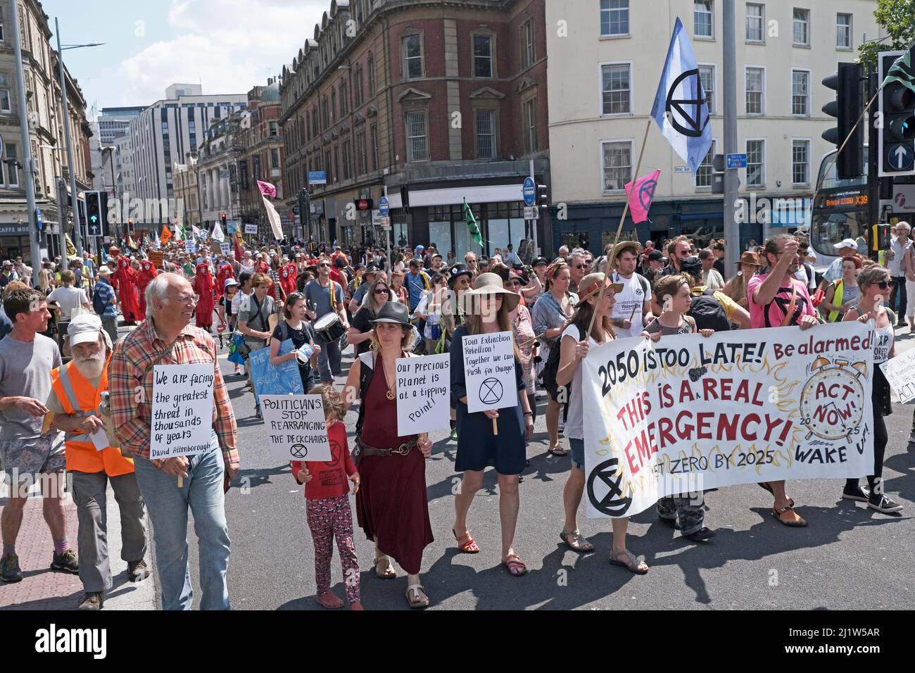Extinction Rebellion climate change protesters marching through city centre. Bristol, England, UK. 16 July 2019. Stock Photo