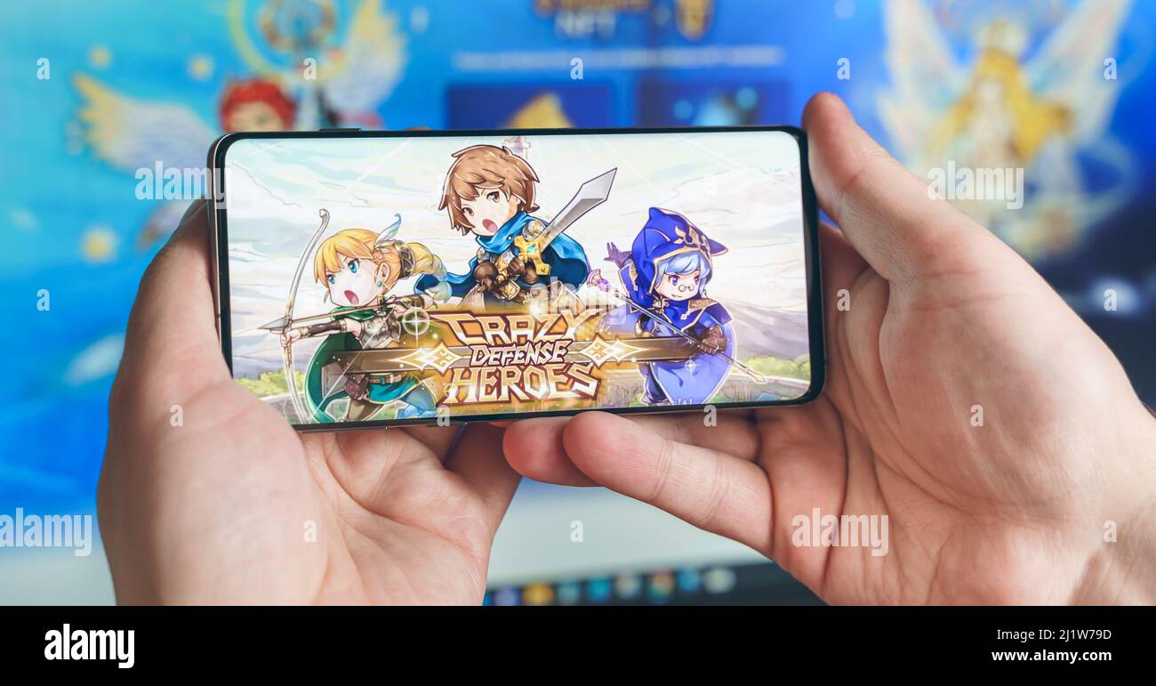 Russia Moscow 25.12.2021 Logo of Crazy Defense Heroes. Blockchain nft  ethereum cryptocurrency strategy game in laptop,mobile phone.Man playing  for cry Stock Photo - Alamy
