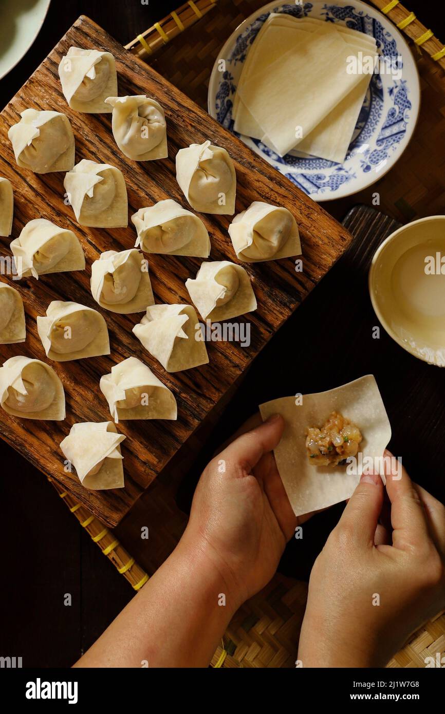 Freshly Made Wontons on Kitchen Countertop Stock Photo