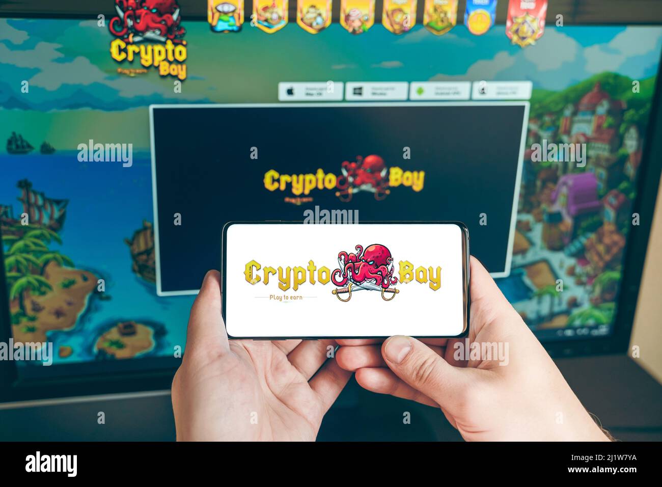 Russia Moscow 25.12.2021 Logo of Cryptobay. PVP,PVE token, blockchain nft ethereum  cryptocurrency strategy game in laptop,mobile phone.Man playing for Stock  Photo - Alamy