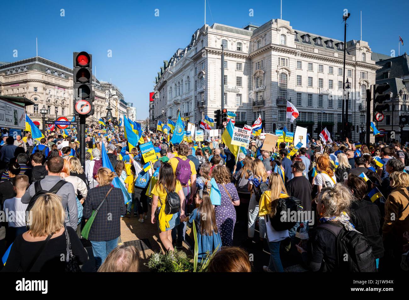 Thousands march in solidarity against the war in Ukraine. 'London Stands With Ukraine' shows the support for the Ukrainian people. Peace march London. Stock Photo