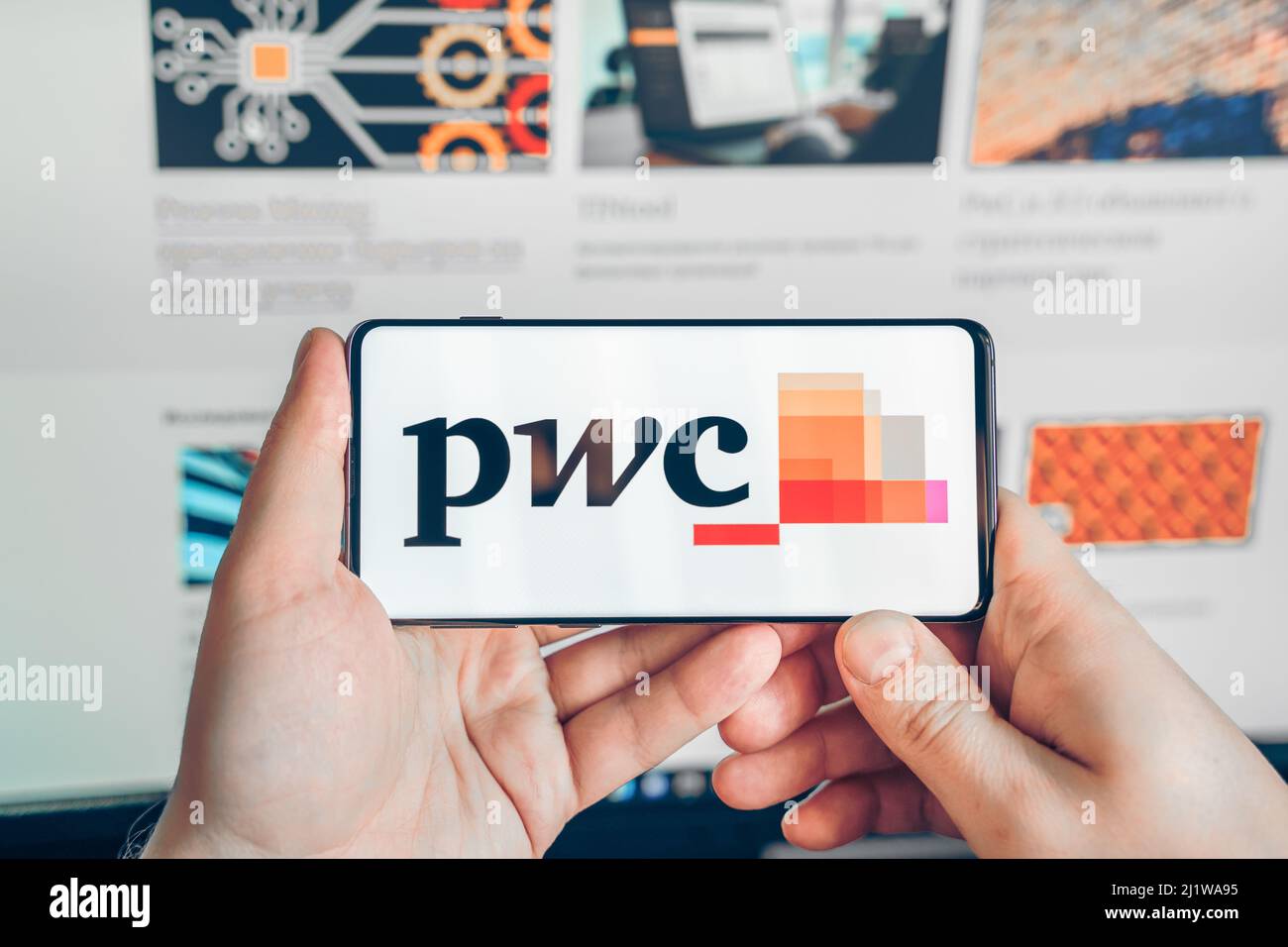 russia-moscow-25-12-2021-logo-of-pwc-ar-experience-metaverse-man-playing-blockchain-nft-ethereum-cryptocurrency-strategy-game-in-laptop-mobile-phone-c-stock-photo-alamy