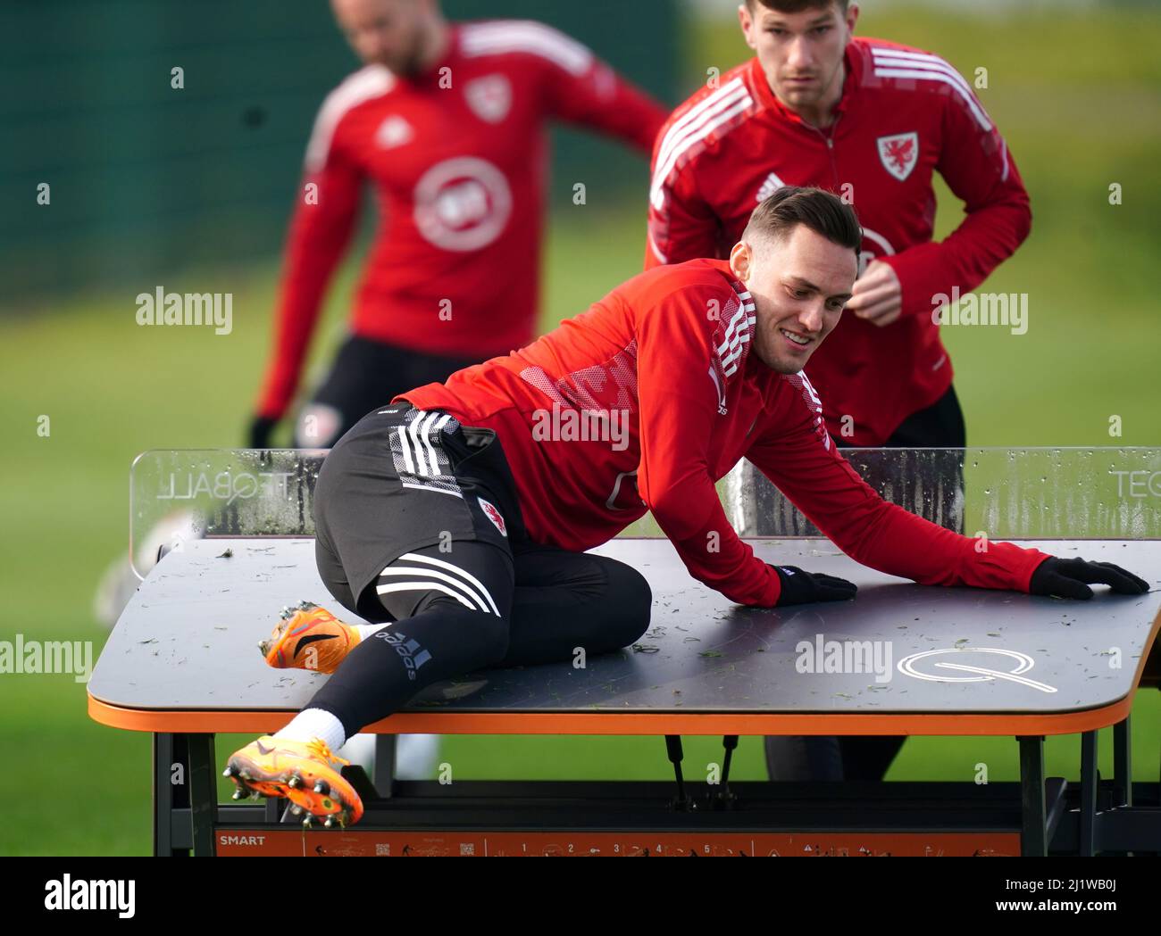 Wales' Connor Roberts playing Teqball with team-mates during a training session at The Vale Resort, Hensol. Picture date: Monday March 28, 2022. Stock Photo