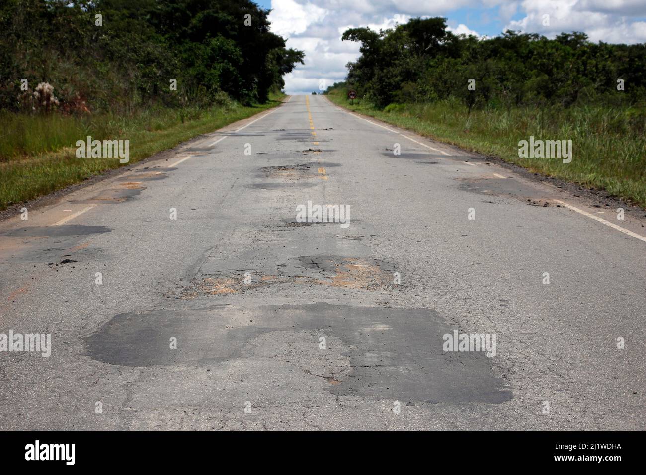highway roof with defective and spoiled asphalt, dangerous for traffic Stock Photo