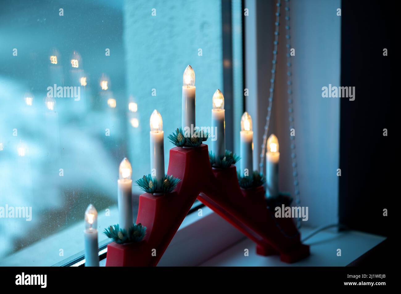 Advent electric candles on window sill Stock Photo Alamy