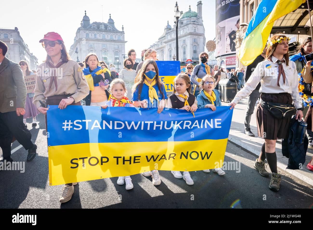 Thousands march in solidarity against the war in Ukraine. 'London Stands With Ukraine' shows the support for the Ukrainian people. Peace march London. Stock Photo