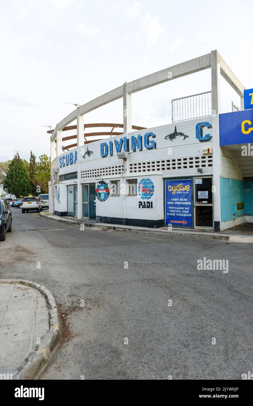 Paphos, Cyprus - Oct 23, 2014: Scuba Diving CyDive dive shop on the Poseidonos Avenue with cars parked outside Stock Photo