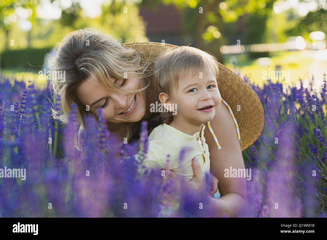 Young woman with her cute little son in a lavender field Stock Photo