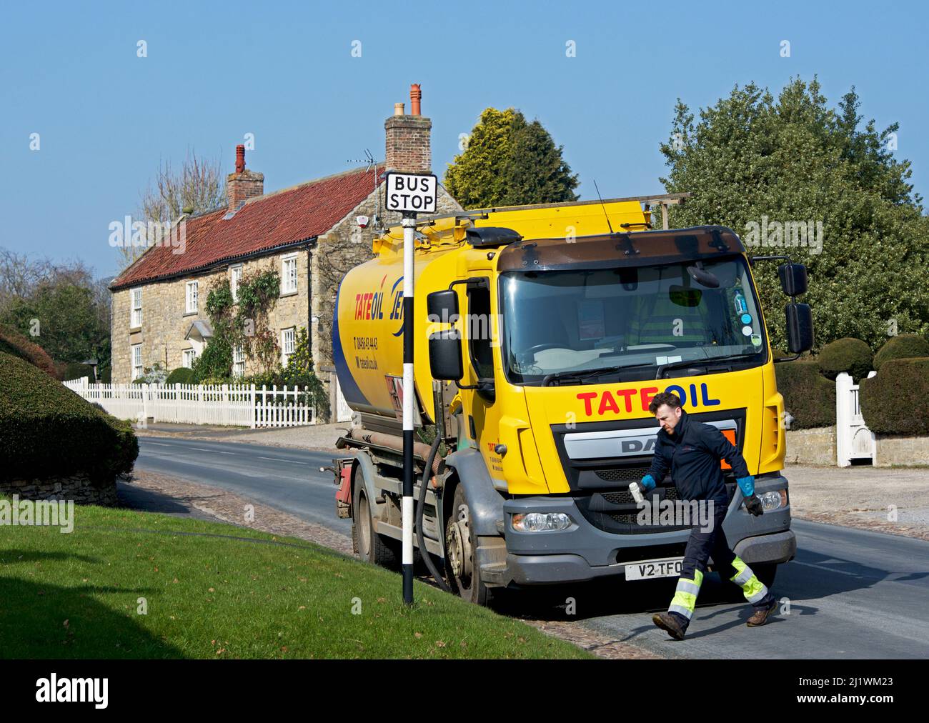 Tate oil lorry, delivering domestic heating oil to house in the village