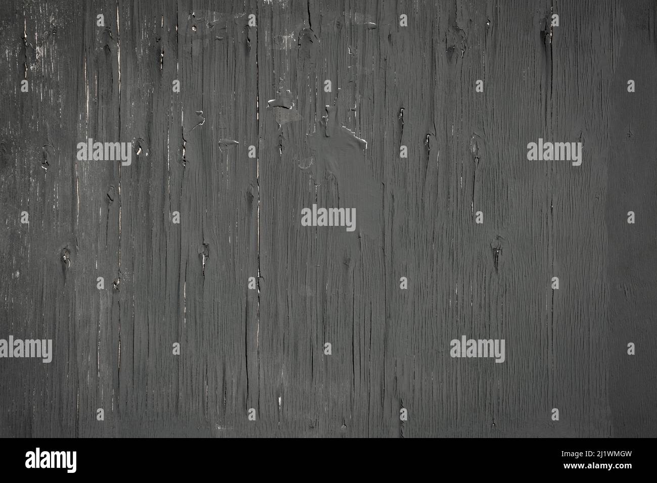 Old black wooden wall with cracked surface texture. Black vintage background Stock Photo