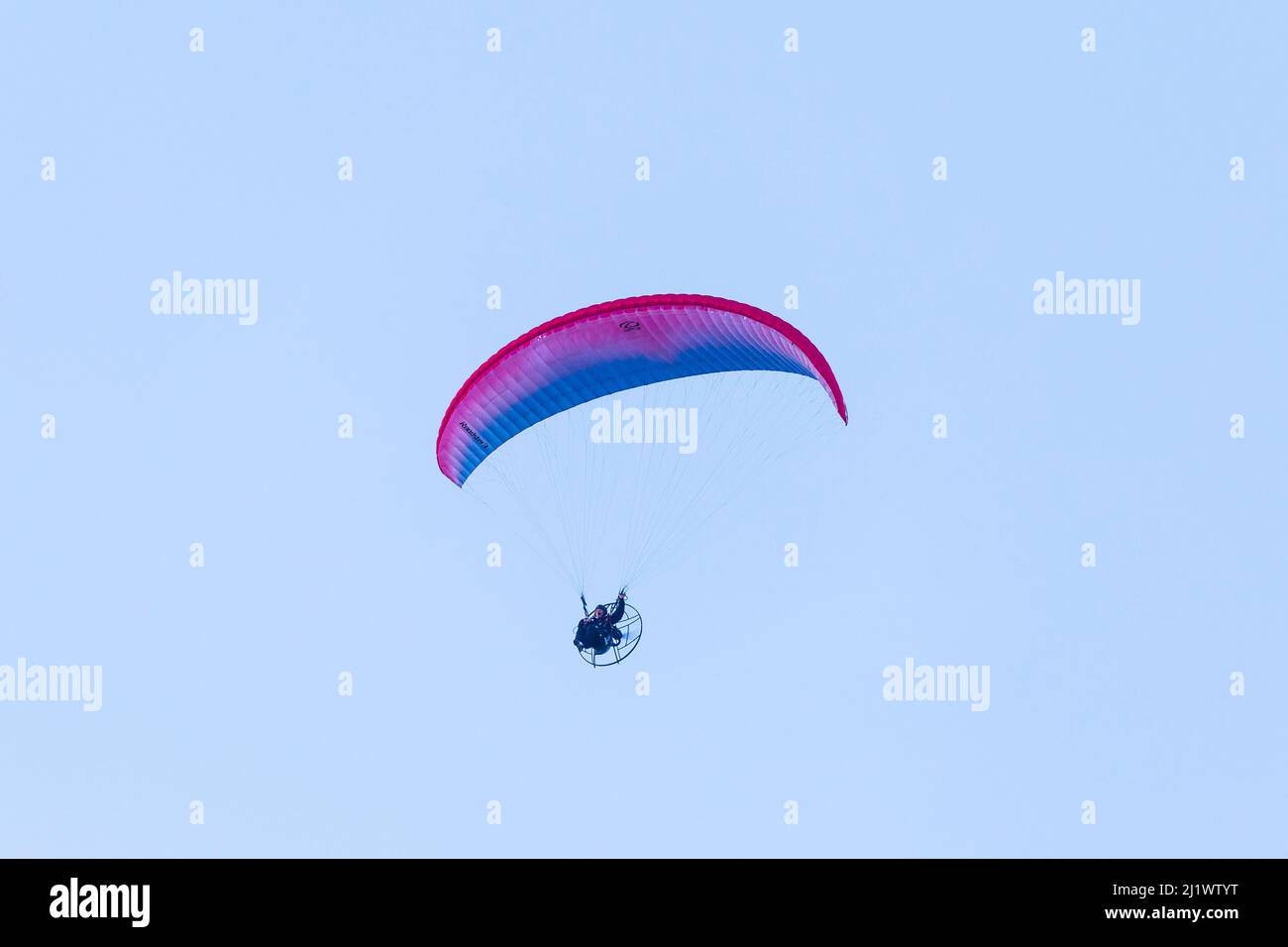 Powered Hang Glider Above the Seafront at Hunstanton on a March Evening Stock Photo