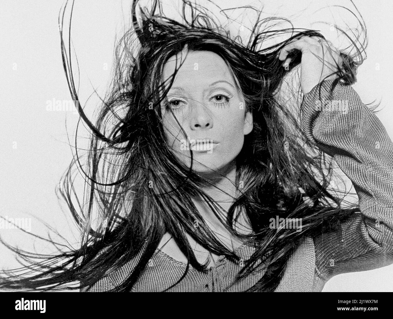 Girl with wind blown hair. Stock Photo