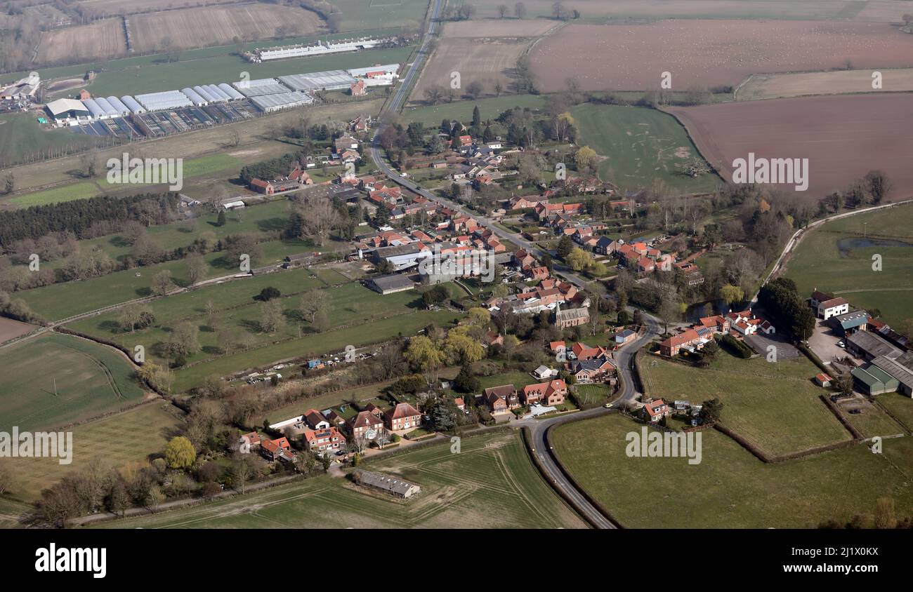 Aerial view of Warthill village in Ryedale, near York. Dalby's Nurseries are in tghe background. Stock Photo