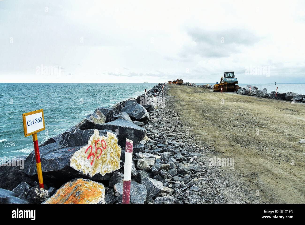 Kribi. 15th Mar, 2022. Photo taken on March 15, 2022 shows the construction site of the breakwater at Kribi Deep Seaport, Kribi, Cameroon. TO GO WITH 'Feature: Chinese-built port, highway in Cameroon boost economy, regional trade' Credit: Kepseu/Xinhua/Alamy Live News Stock Photo