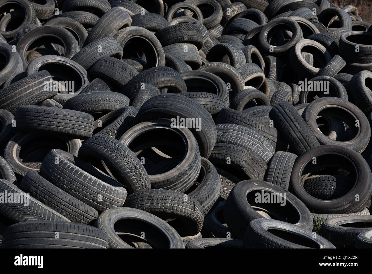 Landfill with old tires and tyres for recycling. Reuse of the waste
