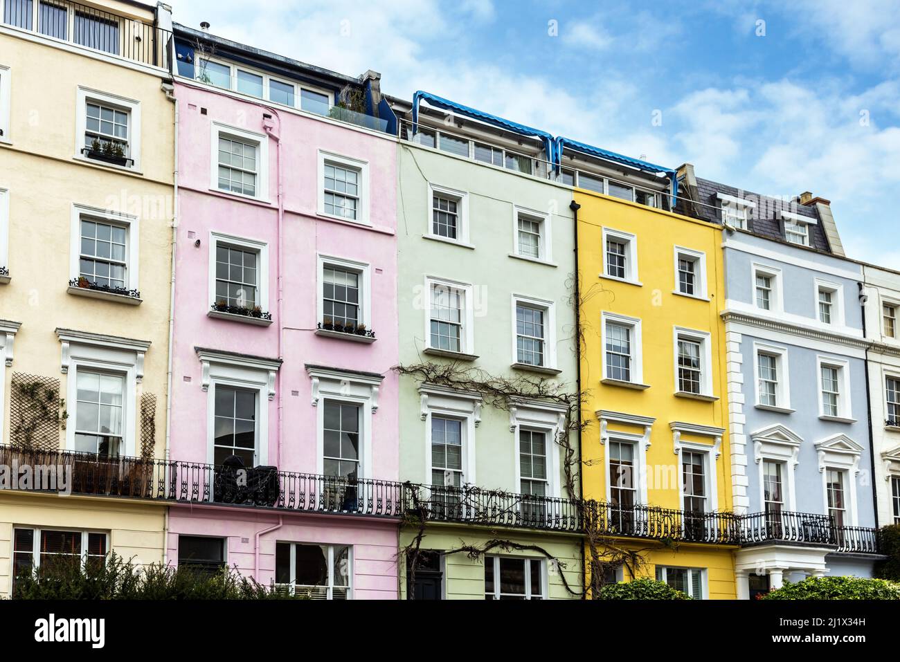 Colourful terraced townhouses with summer sky background. The area of