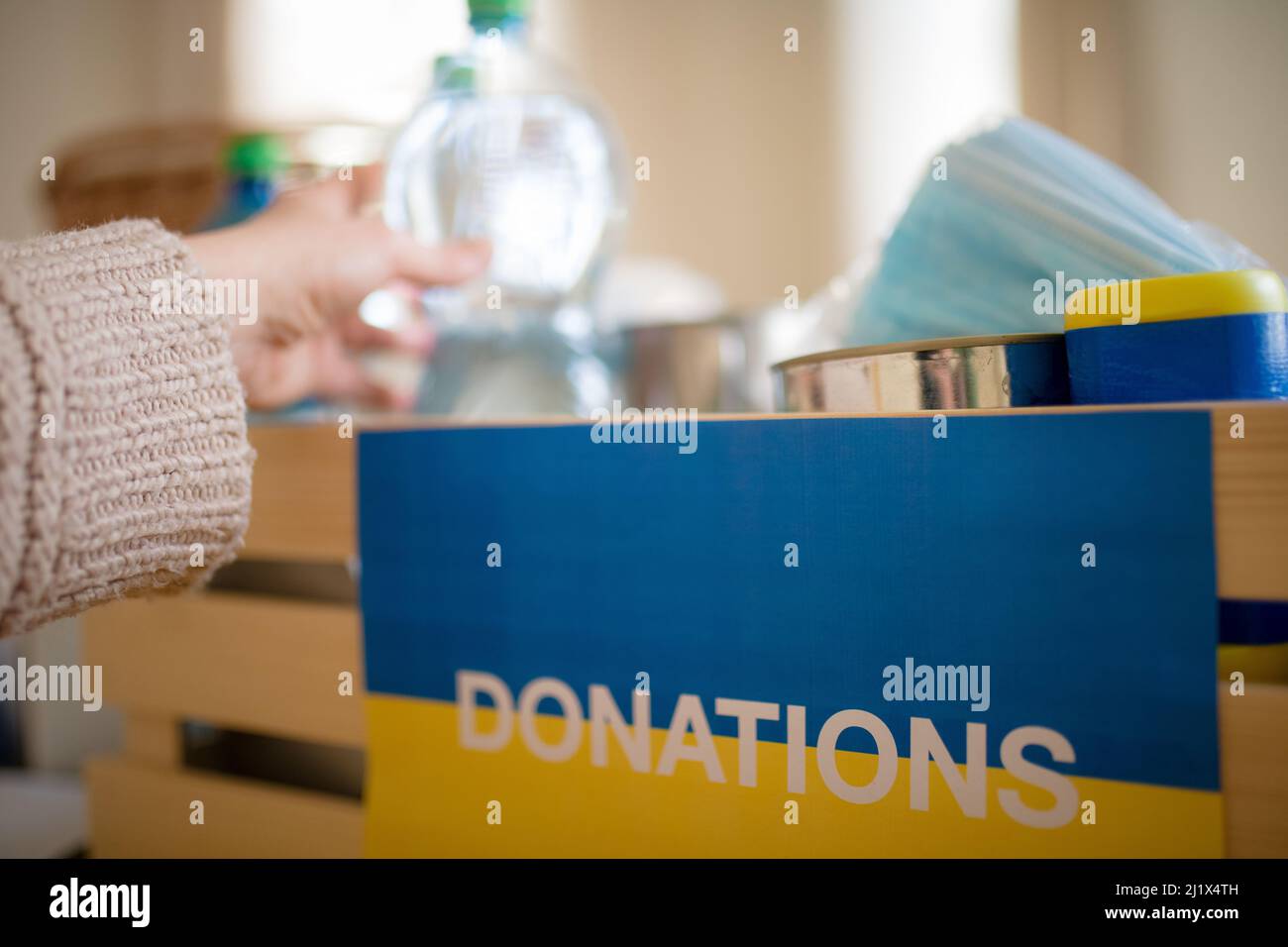 Close up of box of aid for Ukrainian refugees. Humanitarian aid concept. Stock Photo