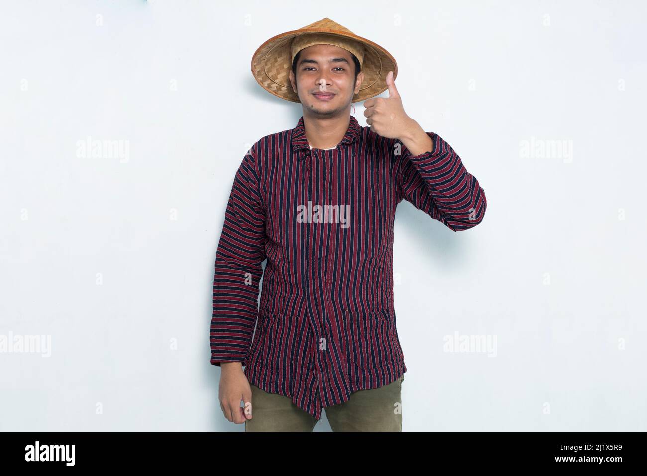portrait of happy farmer showing thumb up isolated on white background ...
