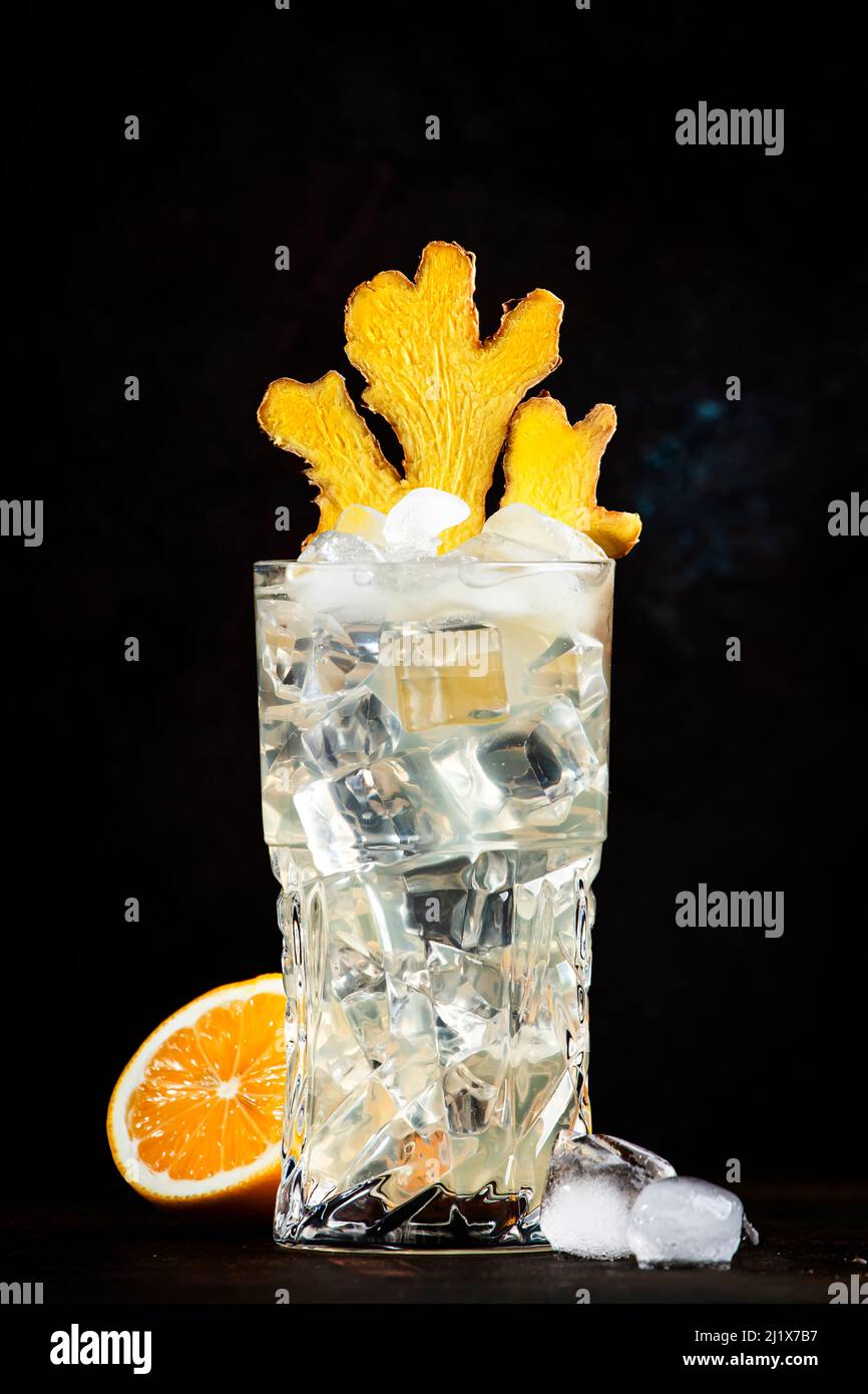 Gin mule alcoholic cocktail with dry gin, lemon juice, soda, lime and