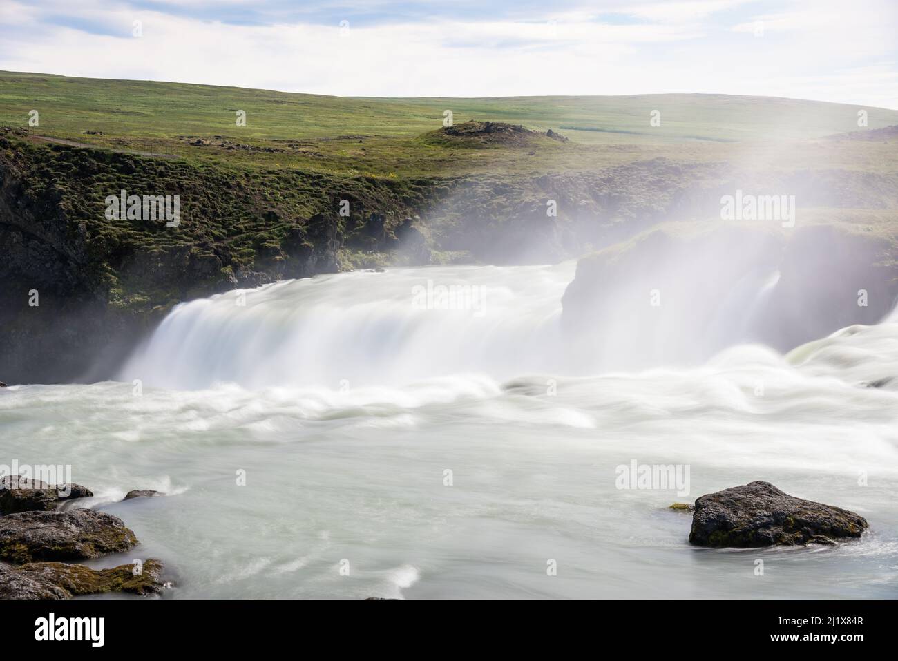 Flowing water near the edge of majestic waterfall. Power in nature concept. Stock Photo