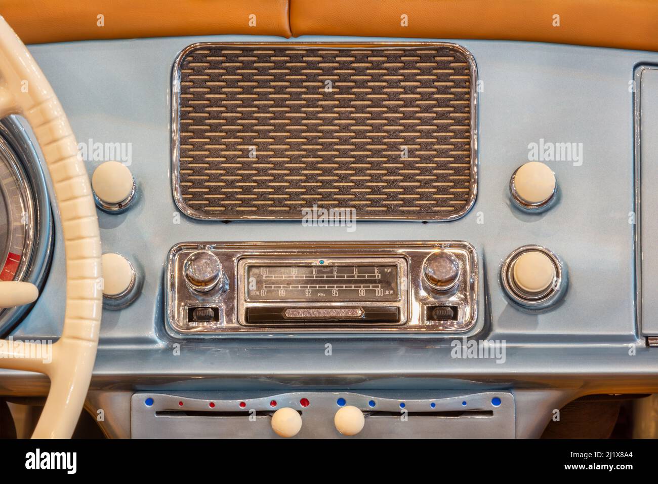 Old chrome car radio with speaker inside a classic American car Stock Photo